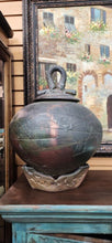 Load image into Gallery viewer, Handmade Raku Style Signed Pottery with lid on stand
