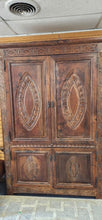 Load image into Gallery viewer, Tall Large Dark Walnut Ornate Carved Front Motif Armoire Cabinet 20th Century
